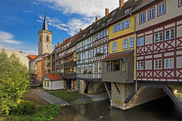 Half-timbered houses of the Kraemerbruecke with the river Gera and the Aegidienkirche