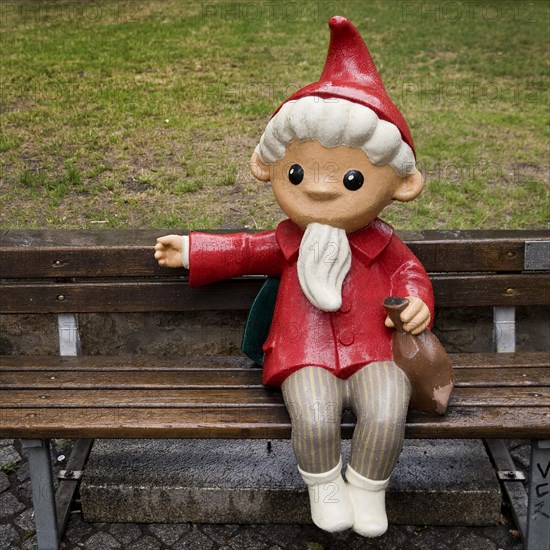 Sculpture of the Sandman on a bench