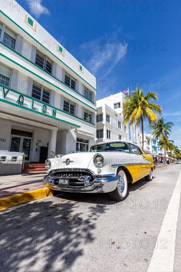 Avalon Hotel Art Deco style architecture and vintage car on Ocean Drive in Miami Beach