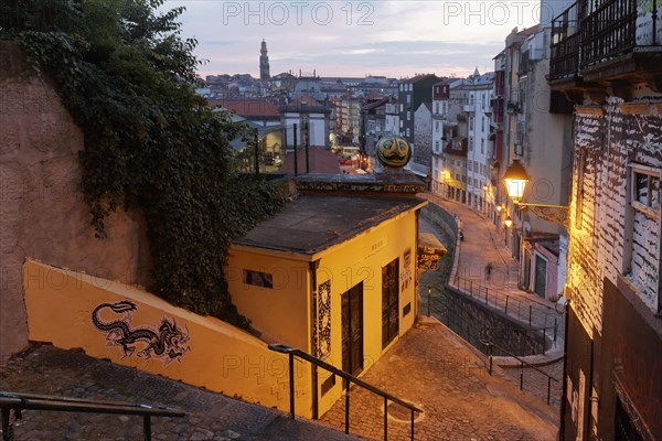 Steep staircase in the light of a alleyway lamp