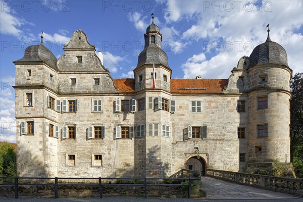 North-west side of Mitwitz moated castle with stone bridge and entrance portal