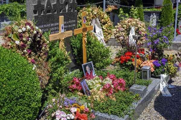 Fresh graves with wreaths and floral decorations