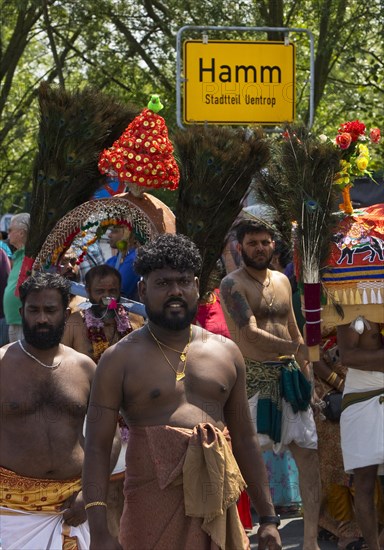 Hindus on the main festival day at the big parade Theer in front of the town sign of Hamm Uentrop