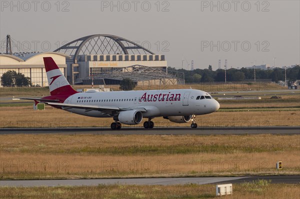 Passenger aircraft Airbus A320-214 of Austrian Airlines taking off at Hamburg Airport