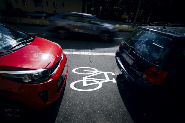 Cars park on a cycle path in Ollenhauerstrasse in Berlin Reinickendorf. The new transport administration in Berlin has stopped several cycle path projects in Berlin. Berlin