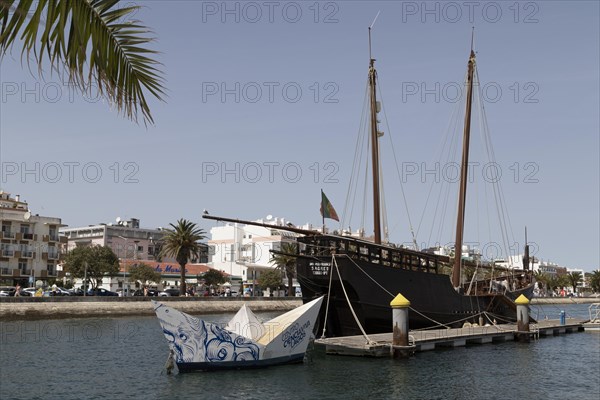 Advertising for the Centro Ciencia Viva de Lagos and museum ship Caravel Boa Esperanca in the port of Lagos