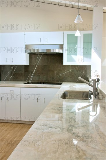 Travertine countertops inside modern kitchen