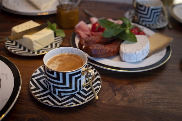 Breakfast with a coffee in a luxurious cup.