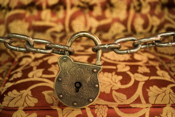 The Old rusted metal lock in metal chains