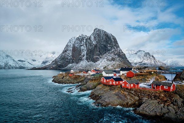 Hamnoy fishing village with red rorbu houses in Norwegian fjord in winter. Lofoten Islands
