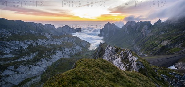 View over Saentis mountains into the valley of Meglisalp at sunrise