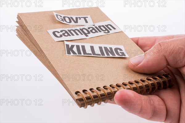 Torn Newspaper Title on a notebook