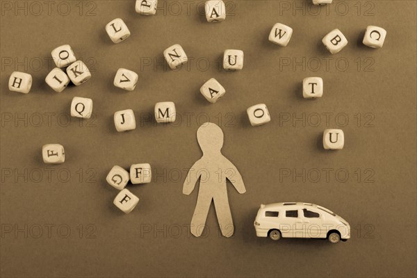 Letter cubes of made of wood and man figurine