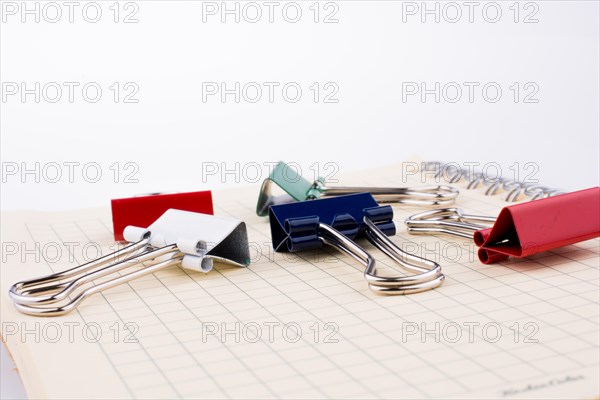 Colorful paper clips on a notebook