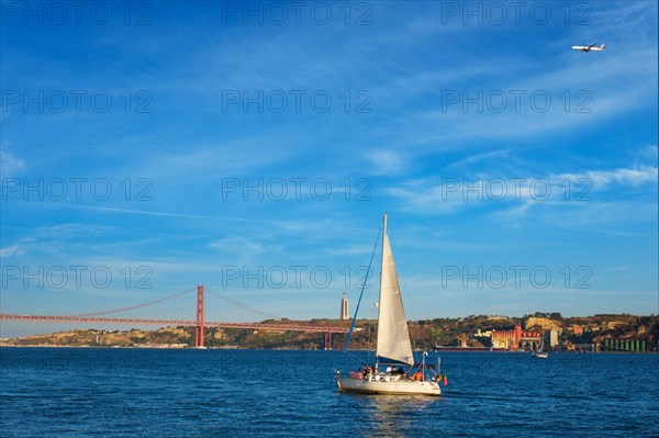 View of 25 de Abril Bridge famous tourist landmark over Tagus river