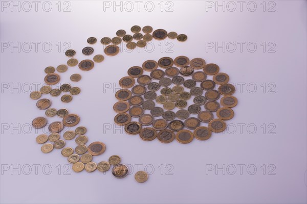 Turkish Lira coins shape a crescent round a circle object on white background