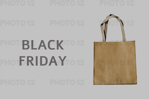 Black Friday. Luxury shopping bag on grey background. It can be use as a template