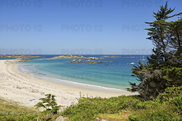 Bay with sandy beach and granite rocks