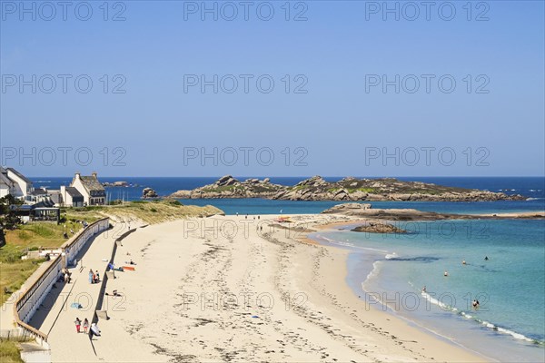 Bay with sandy beach and granite rocks