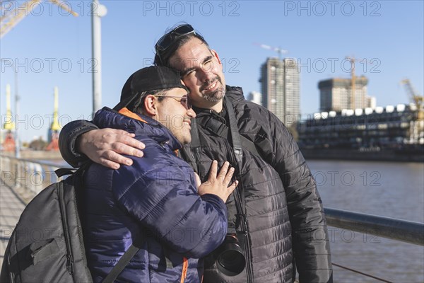 Tourist gay couple posing in Puerto Madero