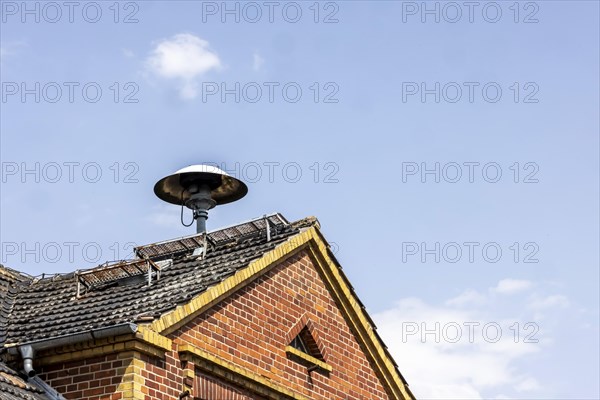 Siren on a roof