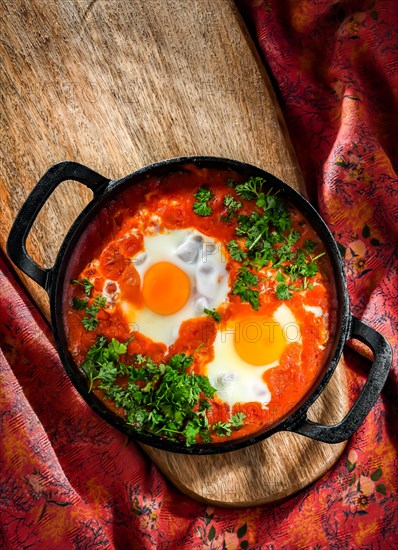 Shakshouka dish in a cast iron pan