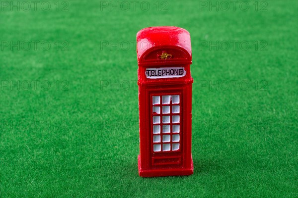 Phone booth on green grass