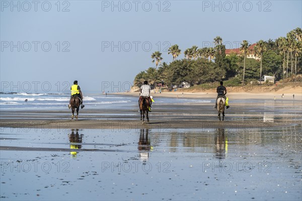Riders on the beach of Fajara