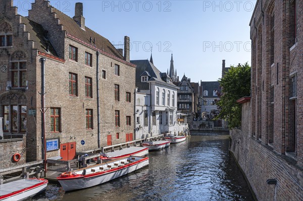 Canal between medieval buildings in the old town of Bruges