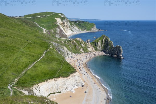 View over the chalk coast with the famous rock bridge Durdledoor