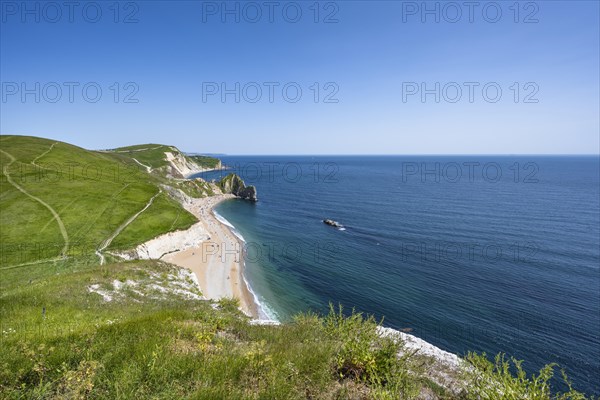 View over the chalk coast with the famous rock bridge Durdledoor