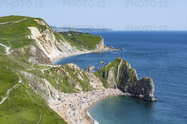 View over the chalk coast with the famous rock bridge Durdledoor