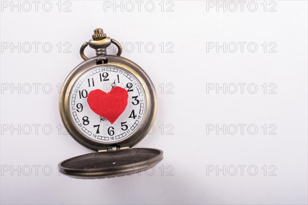 Love concept for valentine's day on retro watch