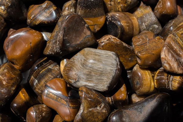 Tiger's eye and hawk's eye gemstone as natural mineral rock specimen