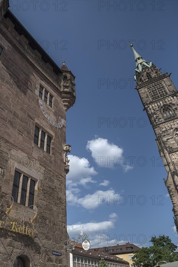 Historic residential tower with sundial and angel sculpture