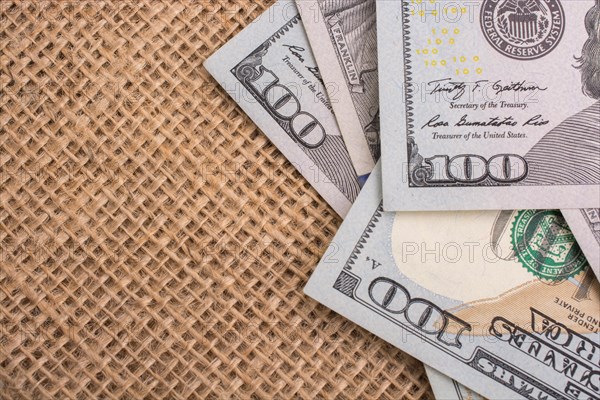 Banknote of US dollar placed on a linen canvas