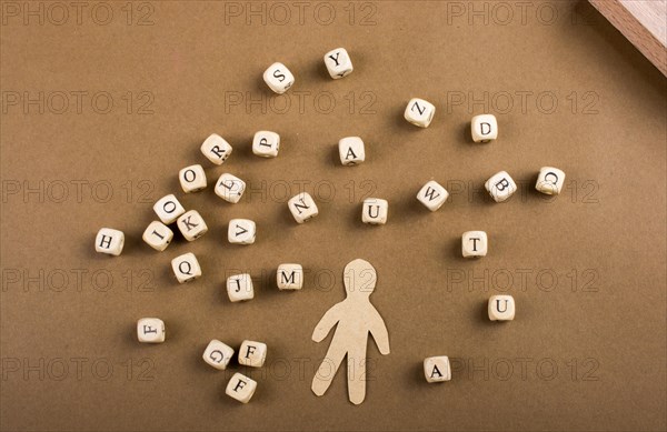 Letter cubes of made of wood and man figurine