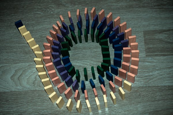 Colorful Domino Blocks in a line on a white background