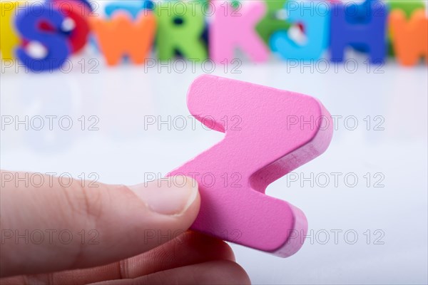 Hand holding letter cube Z of made of wood