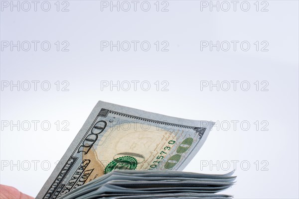 American 100 dollar banknotes made of paper placed on white background