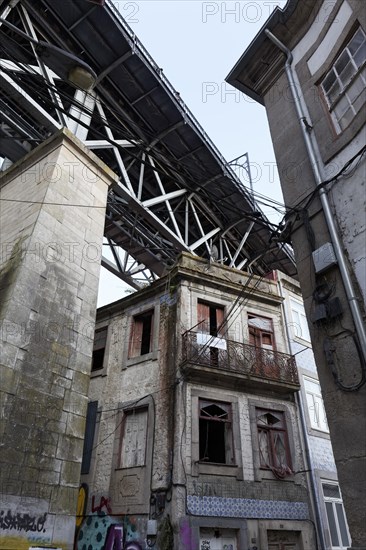 Dilapidated houses under the bridge Ponte D. Luis I