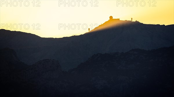 Sunset over the Tramuntana mountains with radar station on the Puig Major mountain