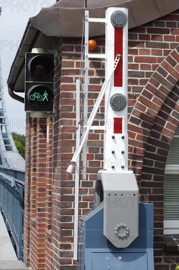 Barrier and pedestrian lights at a footbridge