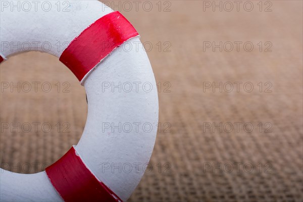Lifesaver or life preserver on a fabric background