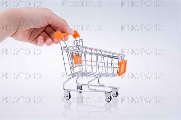 Hand holding a Cart on a white background