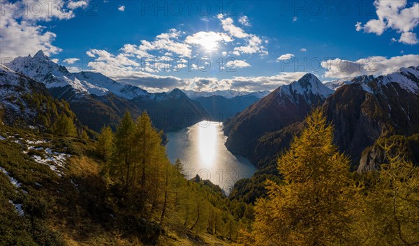 Aerial view over the autumnal forest at Lago di Luzzone in Valle di Blenio