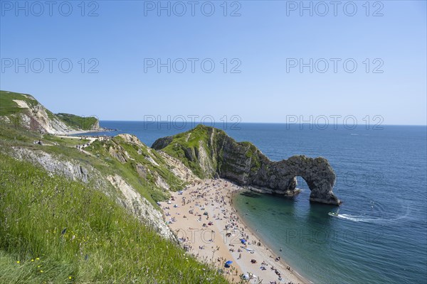 Bathing beach at the famous rock bridge Durdledoor