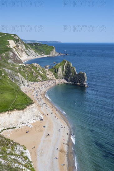 View over the chalk coast with the famous rock bridge Durdledoor