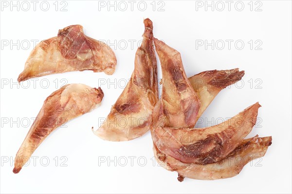 Top view of natural dried treats for dogs. Dried cartilage for dogs isolated on white background