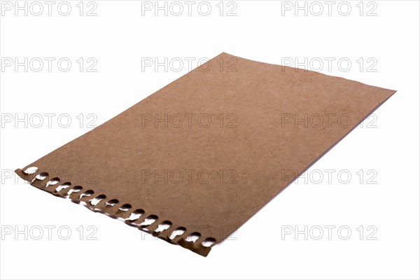 Sheet of brown torn notepaper on a white background